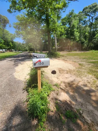 a backyard of a house with yard and outdoor seating