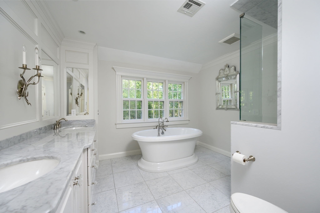 451 Main Street Norwell, MA 02061 - Photo 21 of 31 a bathroom with a sink mirror toilet and bathtub