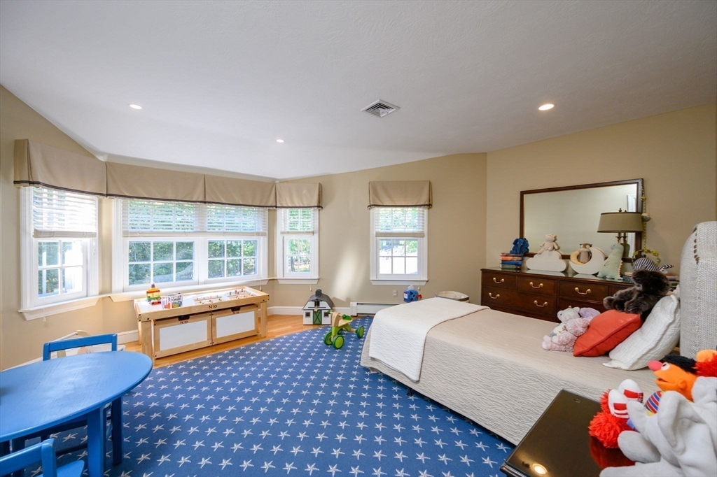 451 Main Street Norwell, MA 02061 - Photo 25 of 31 a bedroom with furniture and a window