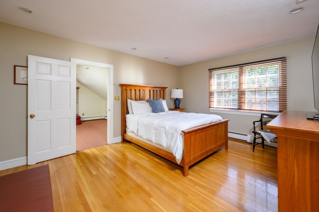 451 Main Street Norwell, MA 02061 - Photo 26 of 31 a bedroom with a bed and wooden floor