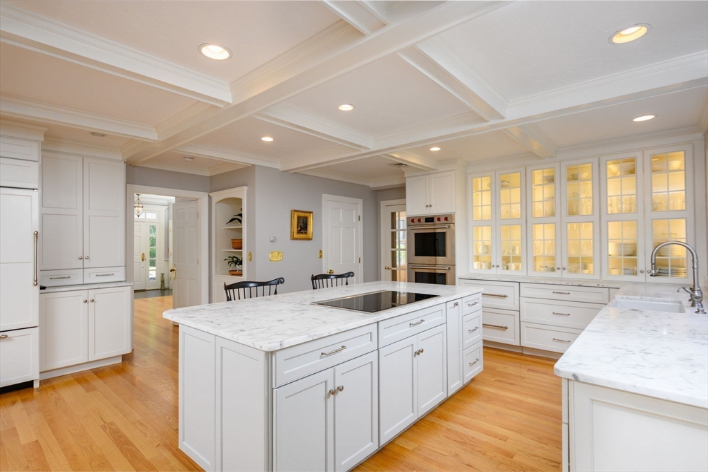 451 Main Street Norwell, MA 02061 - Photo 6 of 31 a large white kitchen with a large window a sink and stainless steel appliances