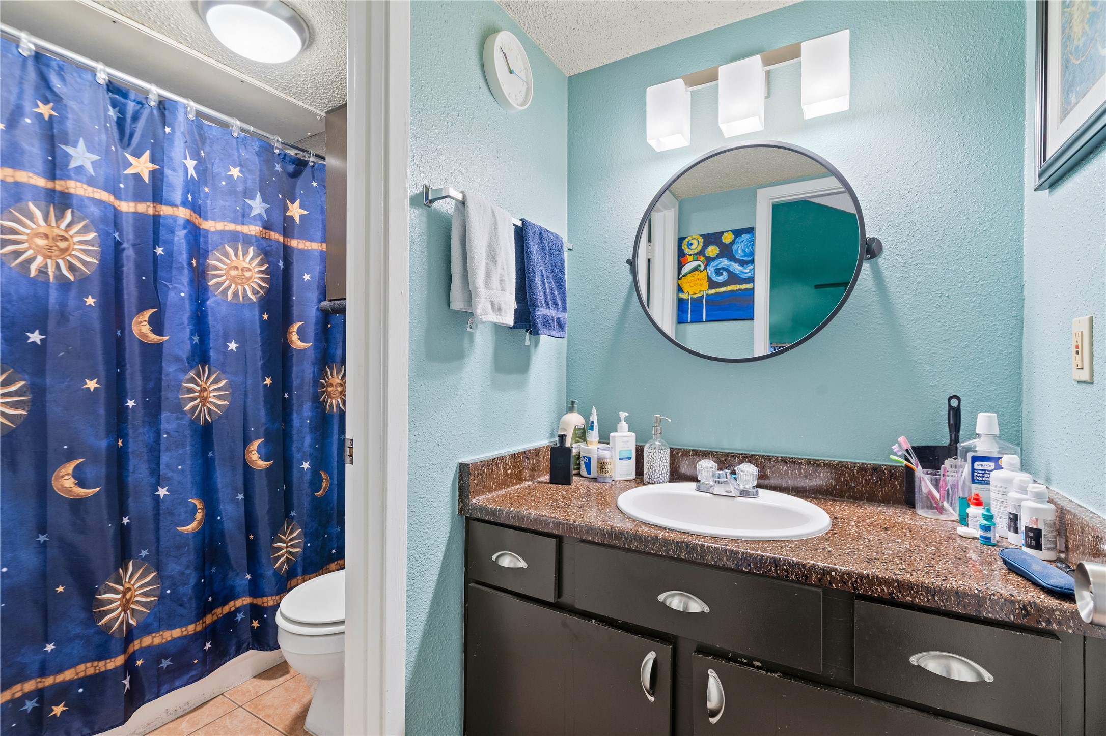 2018 West Rundberg Lane, Unit 4B Austin, TX 78758 - Photo 12 of 28 a bathroom with a sink and a mirror
