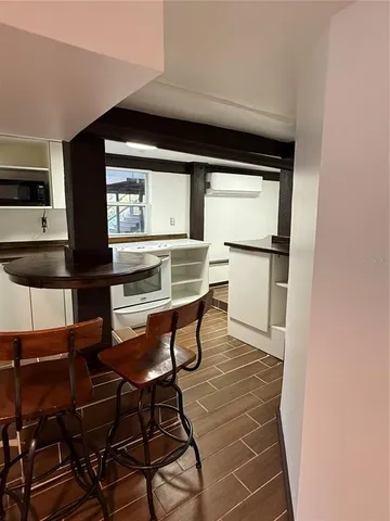 a view of kitchen with furniture and a window