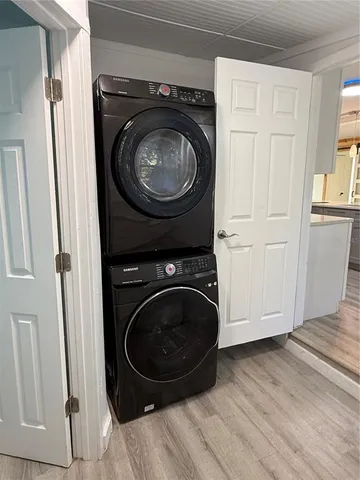 a view of a storage and utility room with washer and dryer