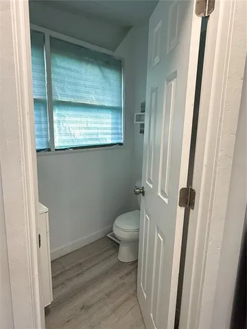 a bathroom with a toilet and a sink