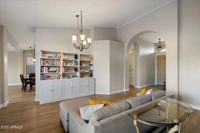 a living room with furniture and potted plant