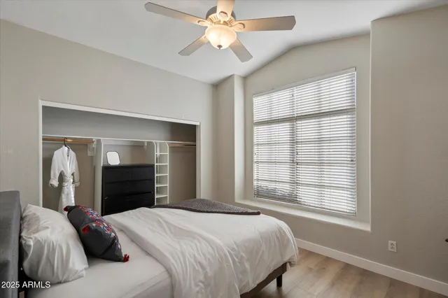 a bed room with a bed and a window