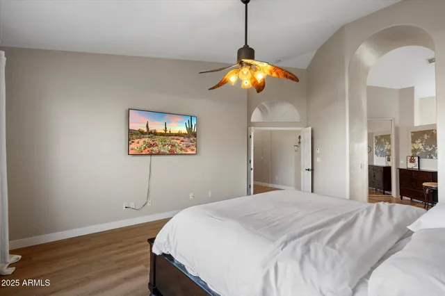 a bedroom with a bed and a dresser