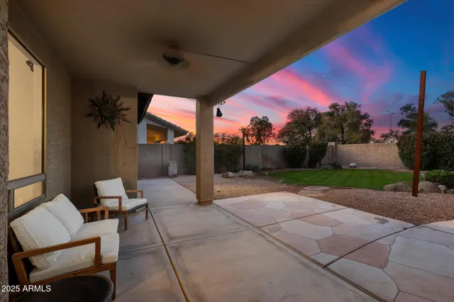 a view of backyard with outdoor seating