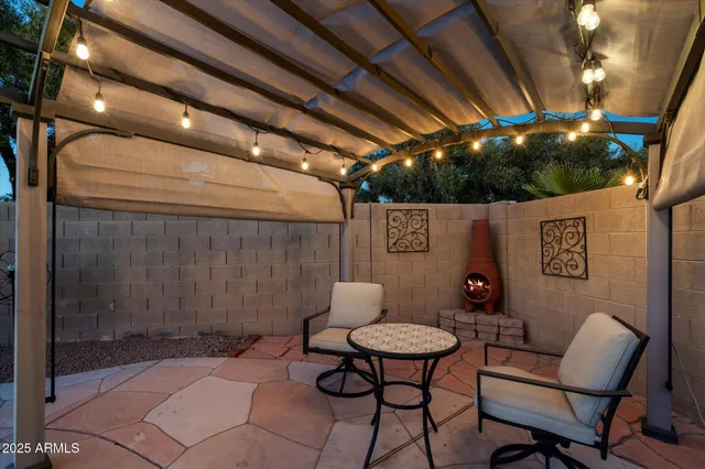 a view of a chairs and table in a patio