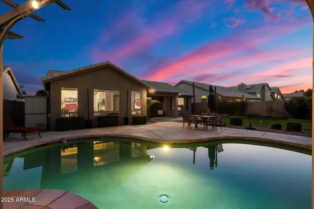 a view of a house with a small yard and plants