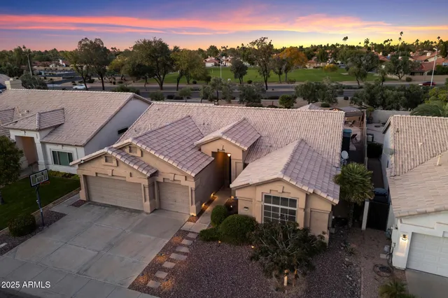 an aerial view of a house with a garden