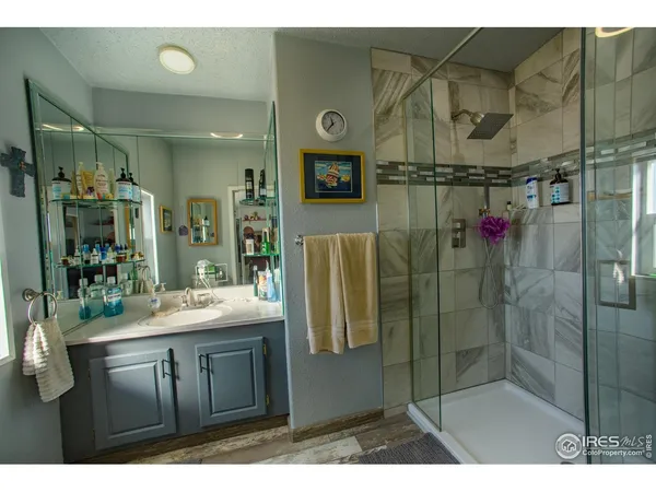 a bathroom with a glass shower door