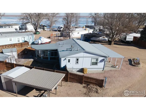 an aerial view of a house with a yard
