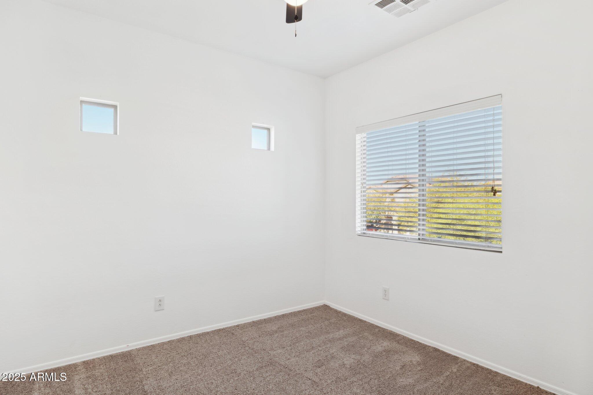 9951 West Bloch Road Tolleson, AZ 85353 - Photo 19 of 33 a view of an empty room with a window