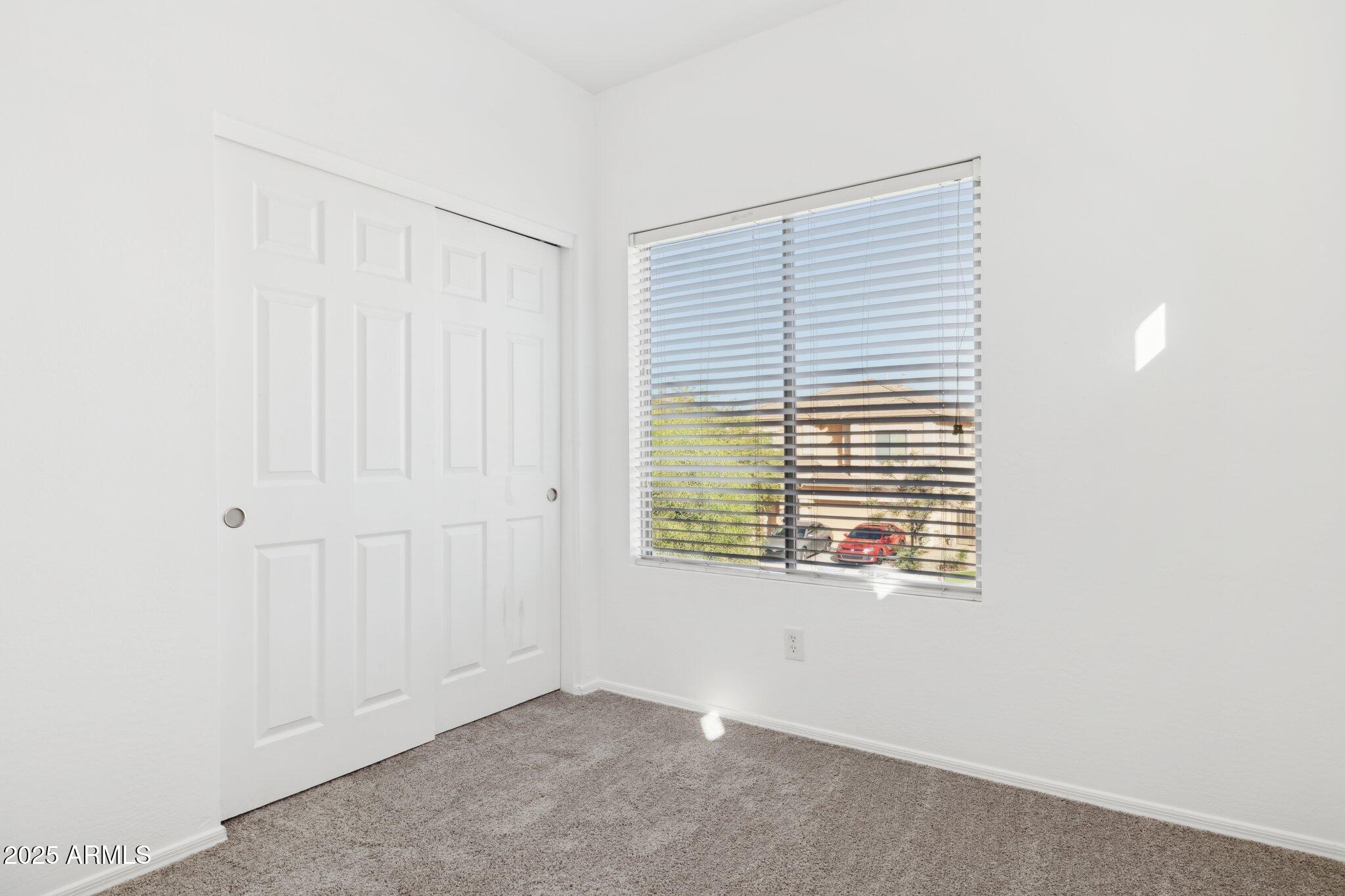 9951 West Bloch Road Tolleson, AZ 85353 - Photo 20 of 33 an empty room with a window