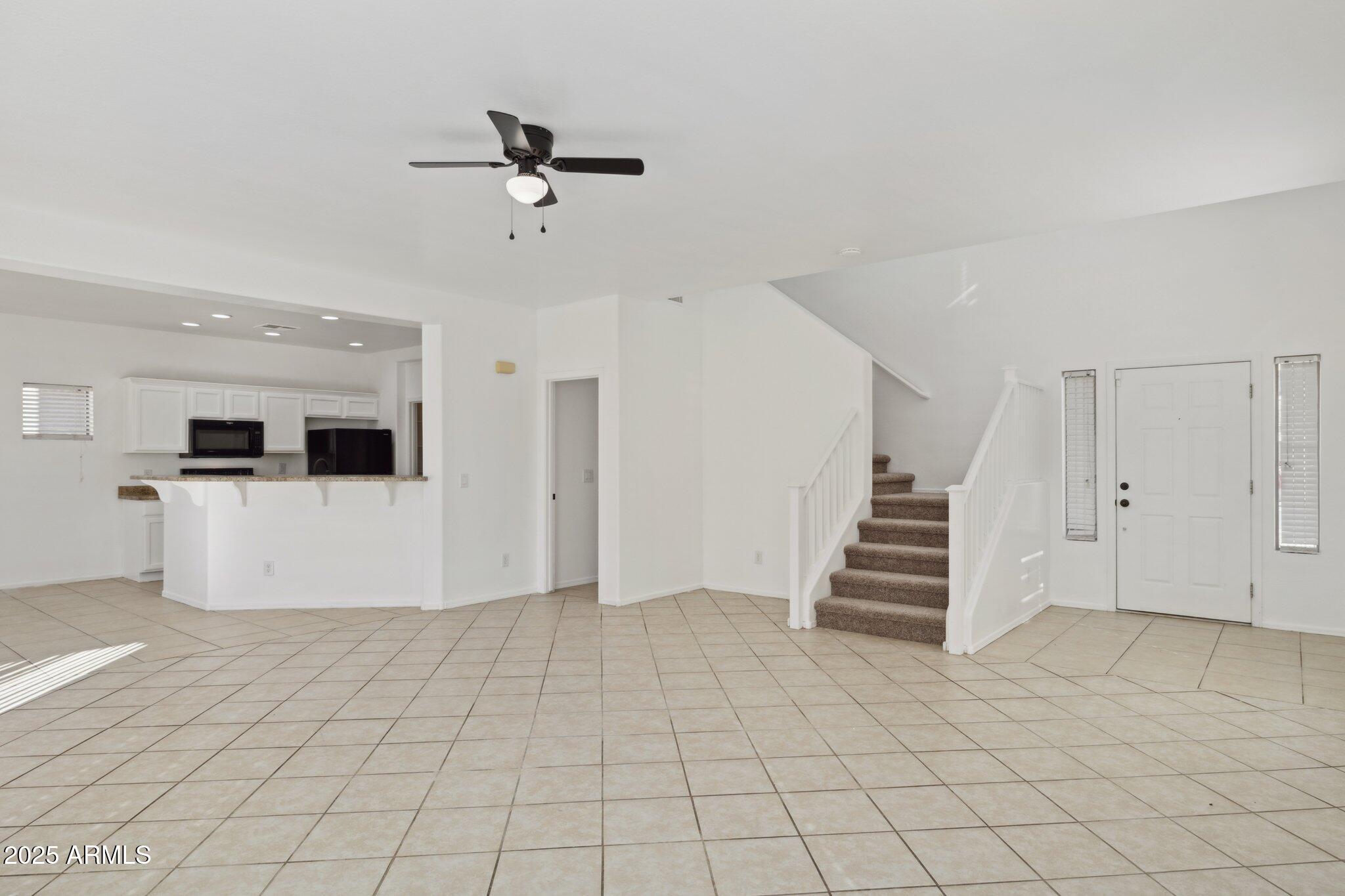9951 West Bloch Road Tolleson, AZ 85353 - Photo 3 of 33 a view of an entryway with stairs