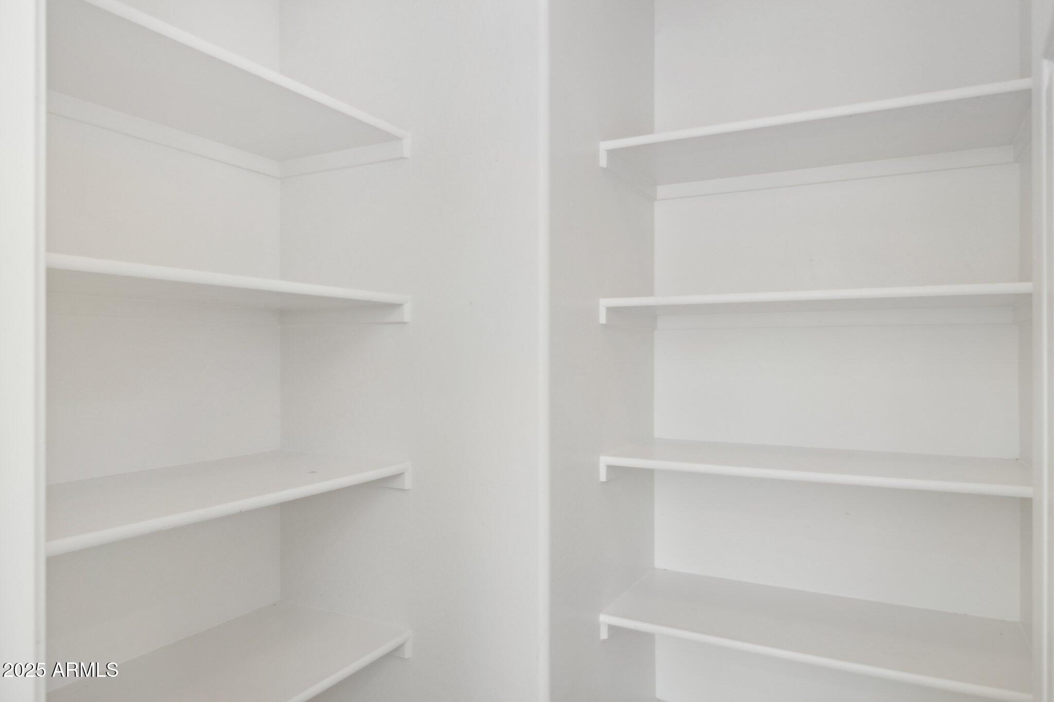 9951 West Bloch Road Tolleson, AZ 85353 - Photo 8 of 33 a view of an empty walk in closet