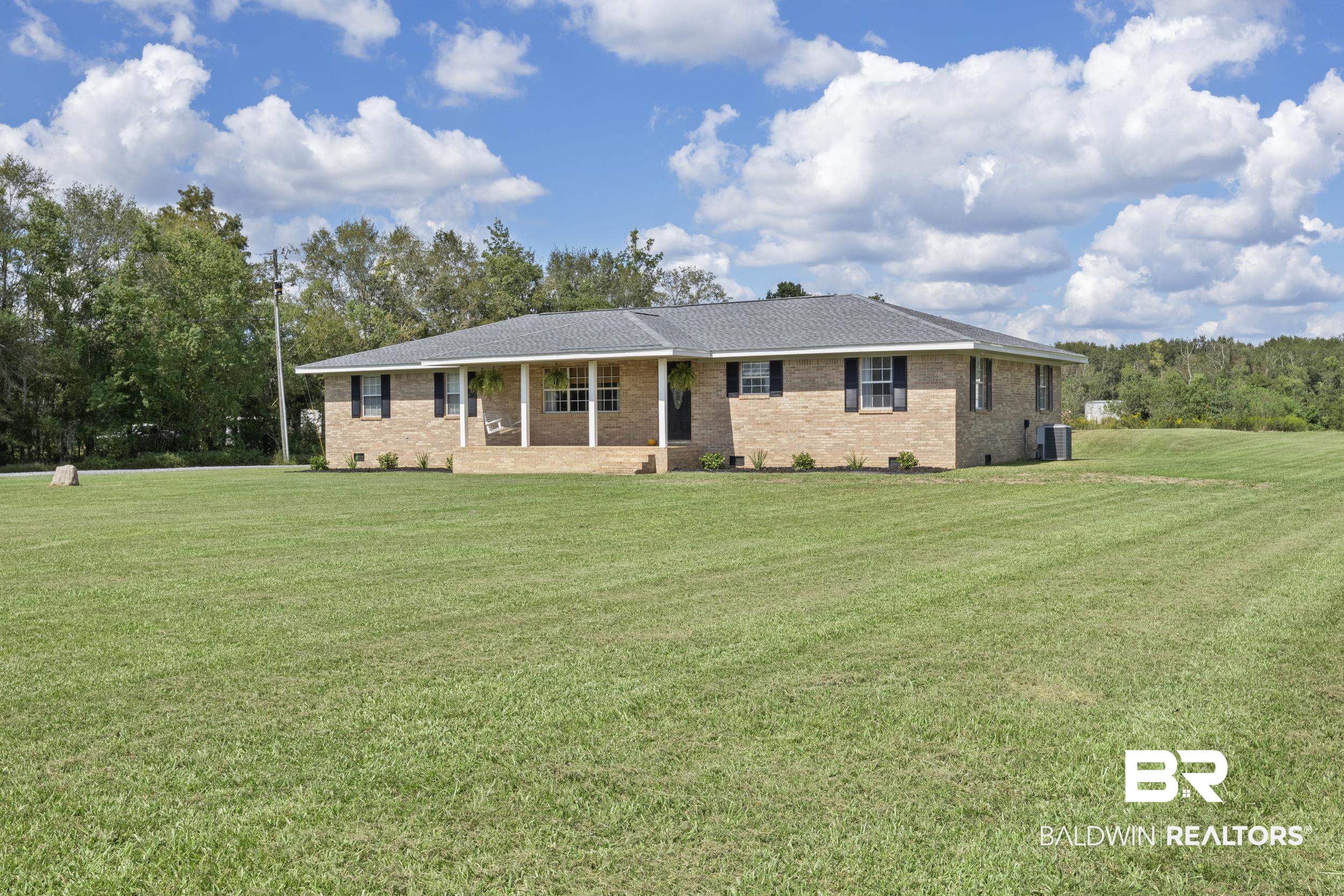 17689 Brewer Road Foley, AL 36535 - Photo 11 of 54 Ranch-style house featuring a front lawn and central air condition unit