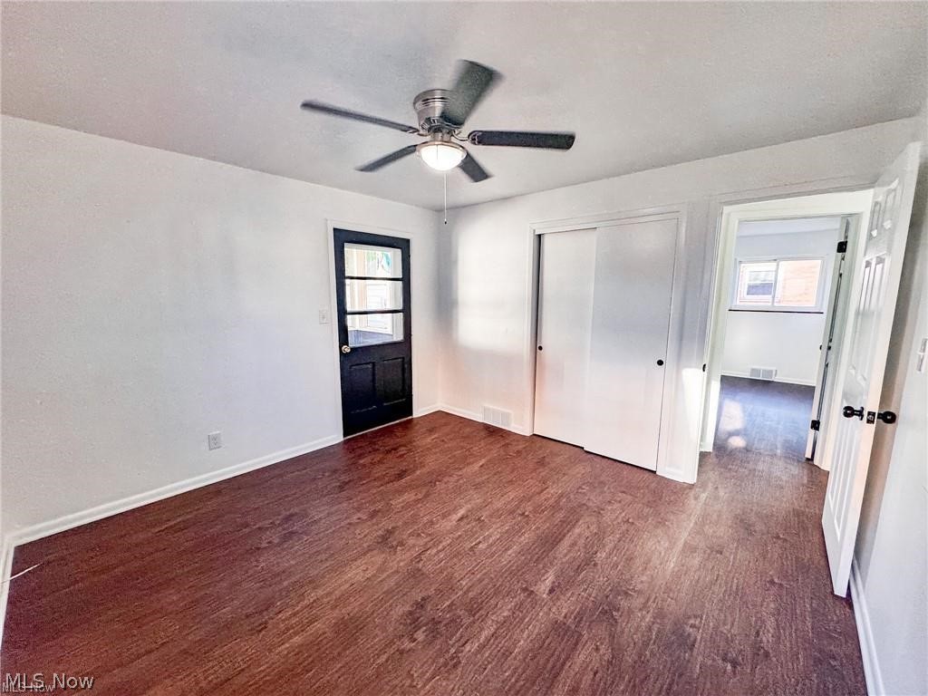 2907 Snow Road, Unit UP Cleveland, OH 44134 - Photo 13 of 19 Unfurnished bedroom with dark wood-style floors, a closet, and a ceiling fan
