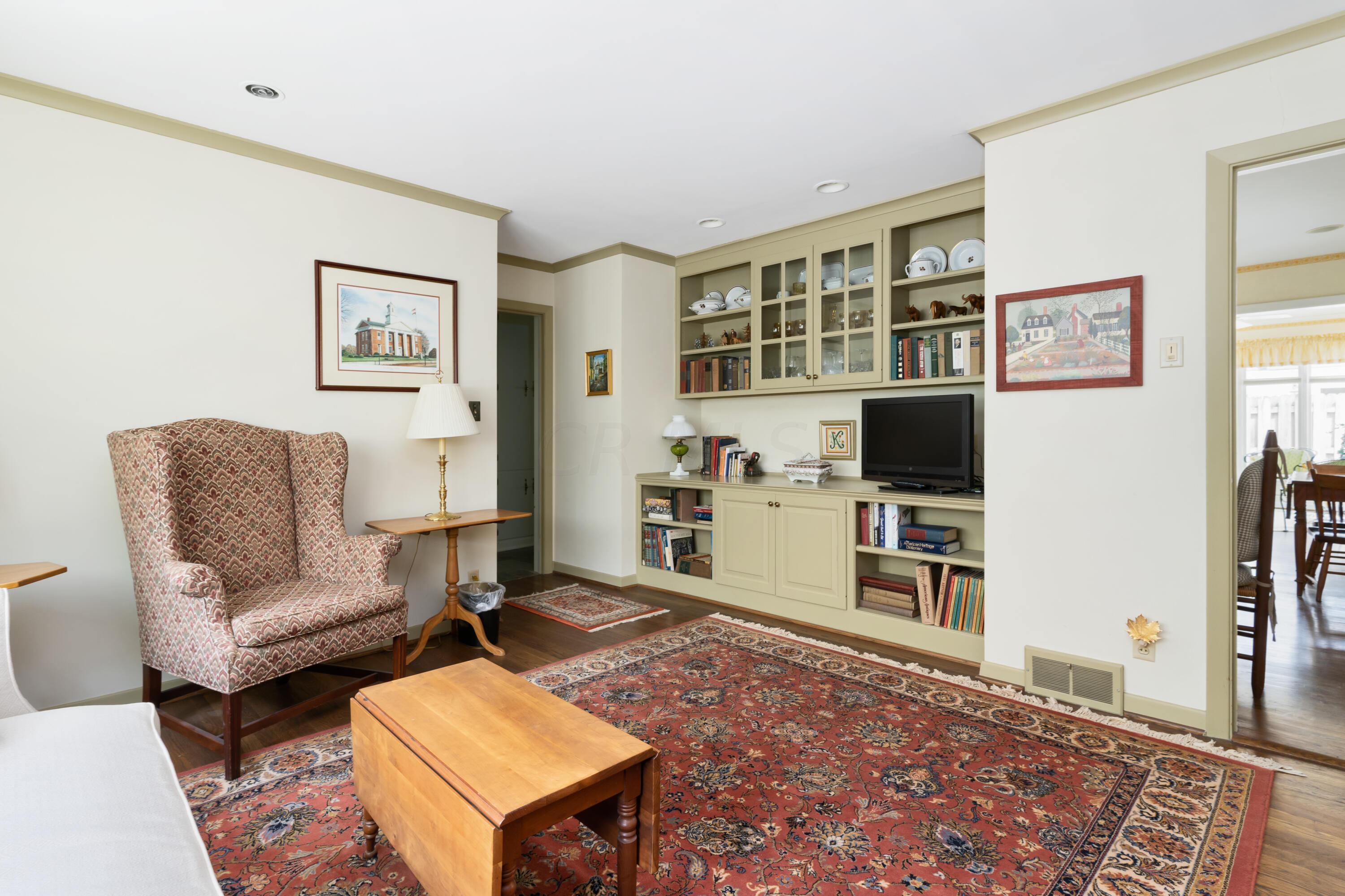 1951 Beverly Road Columbus, OH 43221 - Photo 24 of 48 Hardwood floors, built-in cabinetry, pocket door to kitchen