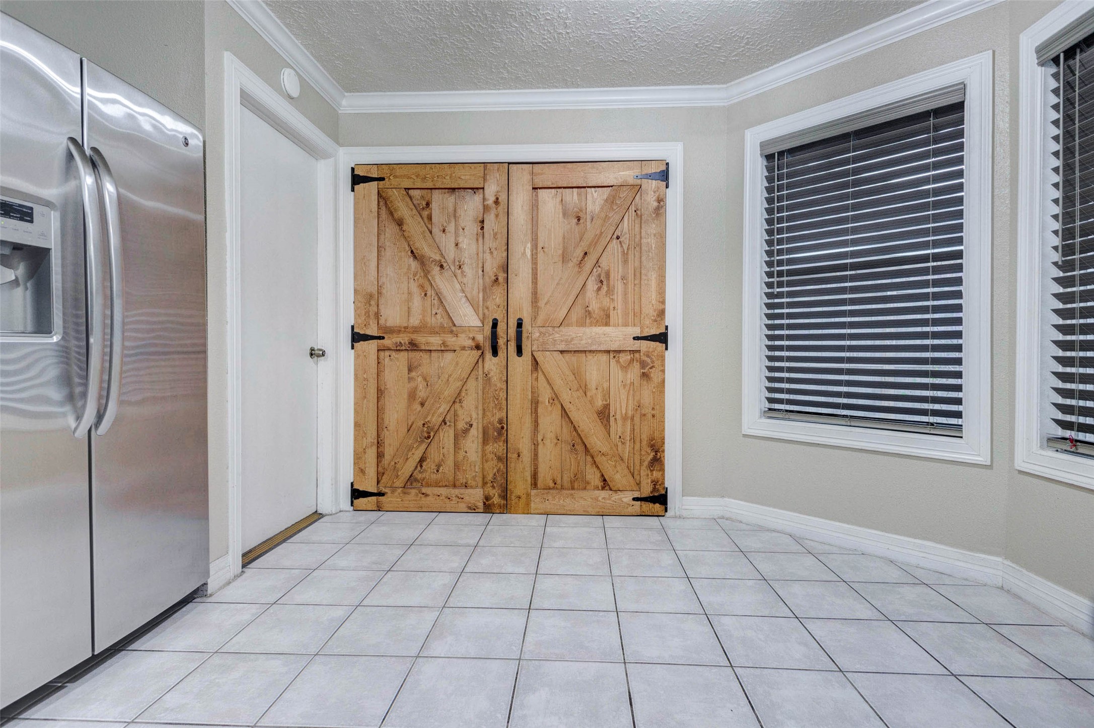 13614 Sablegrove Lane Houston, TX 77014 - Photo 9 of 22 Laundry room w updated doors, 2025 water heater