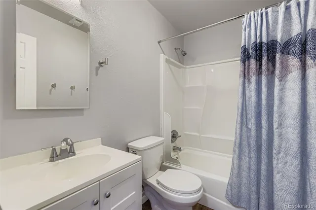 a bedroom with a bed and a book shelf