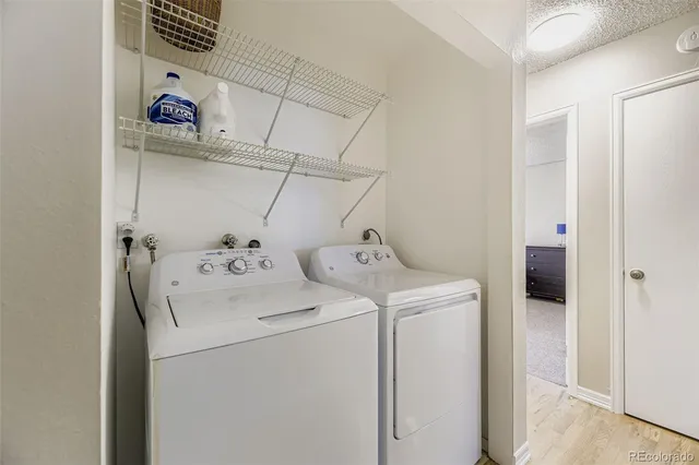 a view of backyard with small cabin and wooden fence