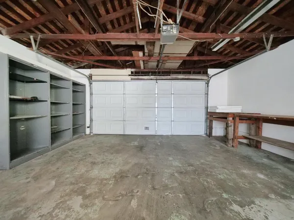a view of an empty room with storage