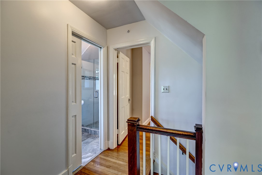 4814 Riverside Drive Richmond, VA 23225 - Photo 21 of 39 a view of a hallway with wooden floor and staircase