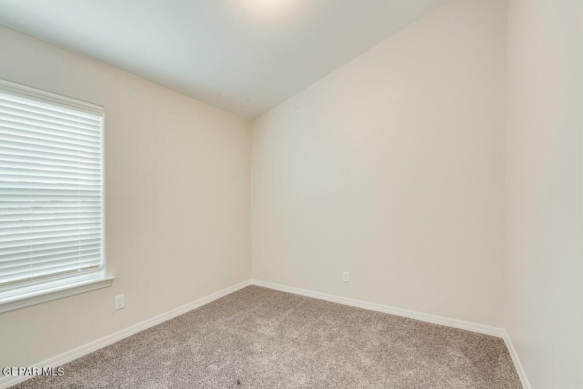 6064 Fall Ridge Street Sunland Park, NM 88008 - Photo 19 of 26 an empty room with a window