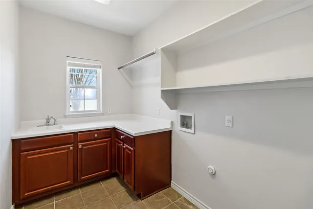 a kitchen with granite countertop stainless steel appliances granite countertop wooden cabinets and a granite counter tops