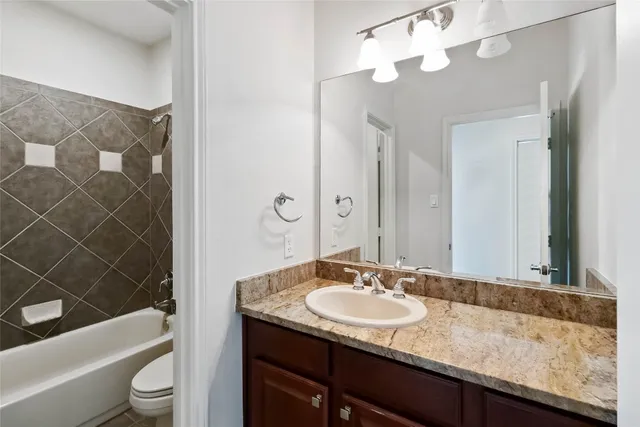 a utility room with cabinets washer and dryer