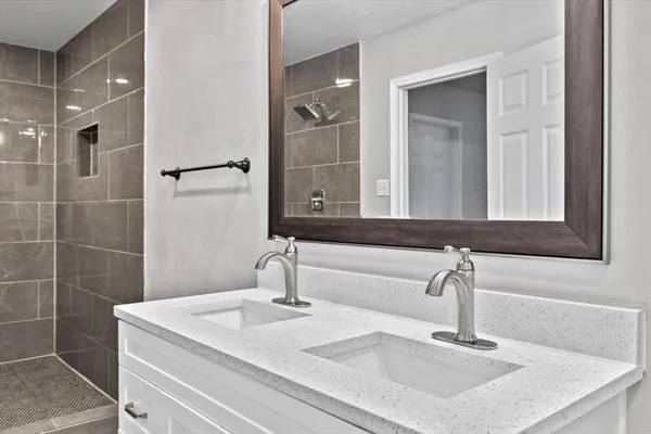 a bathroom with a sink and a mirror