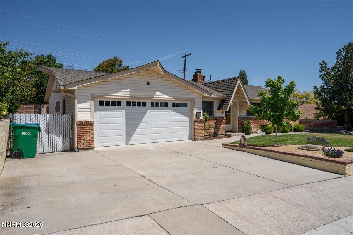 2205 Carlin Street Reno, NV 89503 - Photo 31 of 51 a front view of a house with a yard and garage