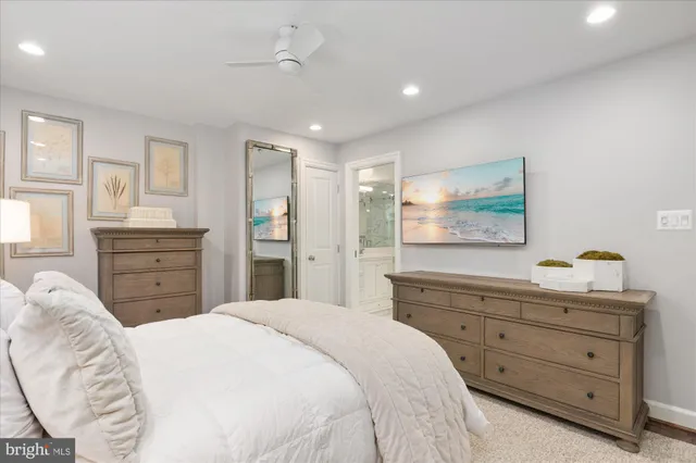 a bathroom with a sink shower and a toilet