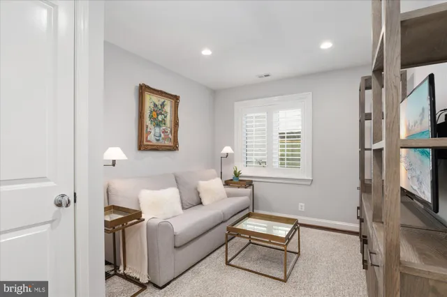 a bathroom with a sink a toilet a mirror and shower