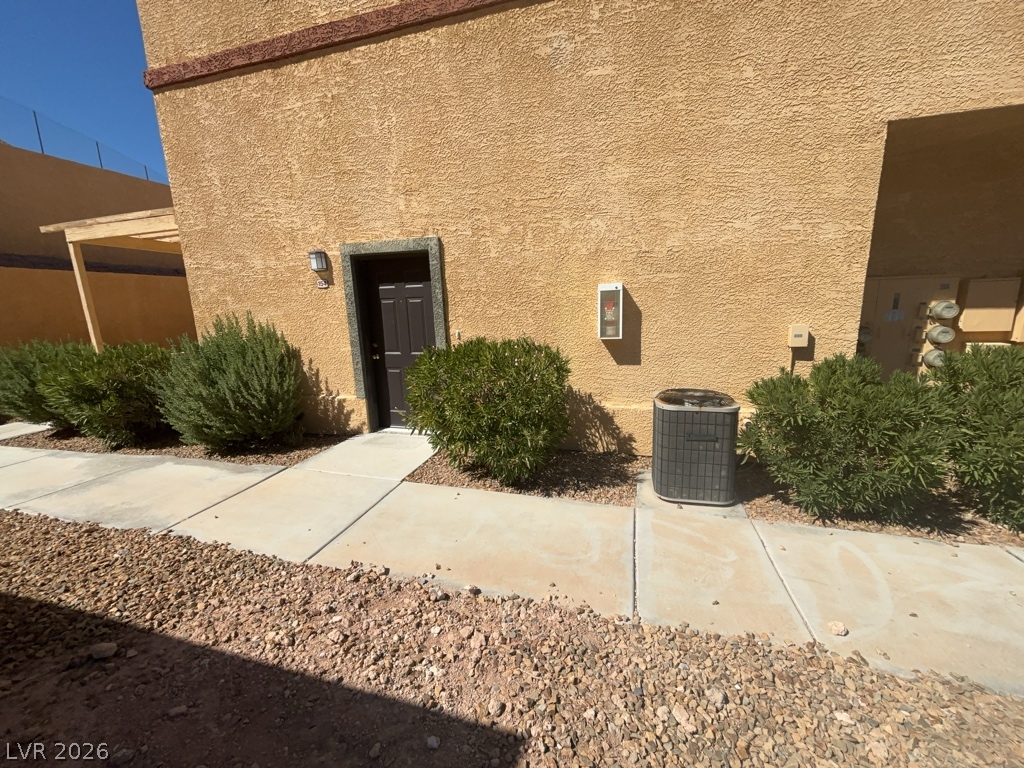 4915 East Russell Road, Unit 154 Las Vegas, NV 89120 - Photo 3 of 20 A paved concrete walkway leads directly to the private stucco exterior entrance.