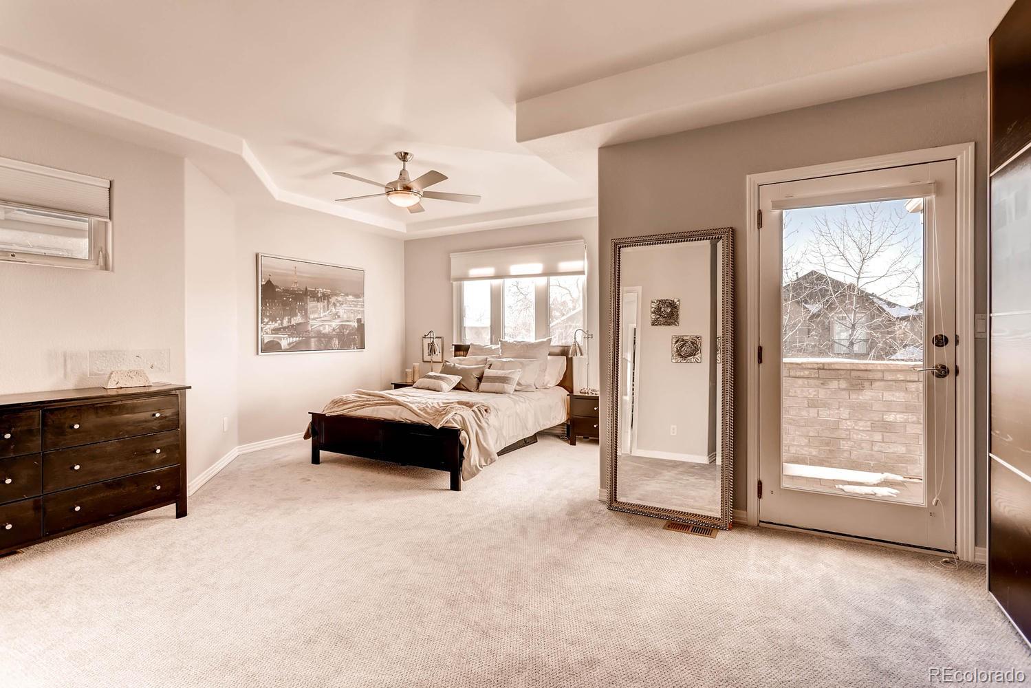 244 South Monroe Street Denver, CO 80209 - Photo 15 of 35 a spacious bedroom with a bed and a dresser