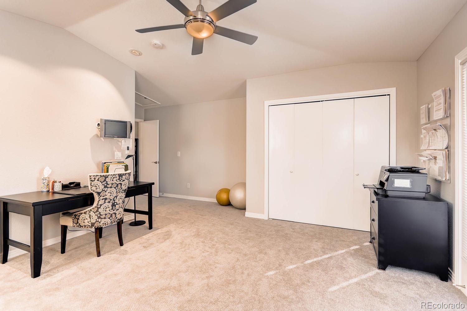 244 South Monroe Street Denver, CO 80209 - Photo 23 of 35 a view of a workspace with furniture and a window