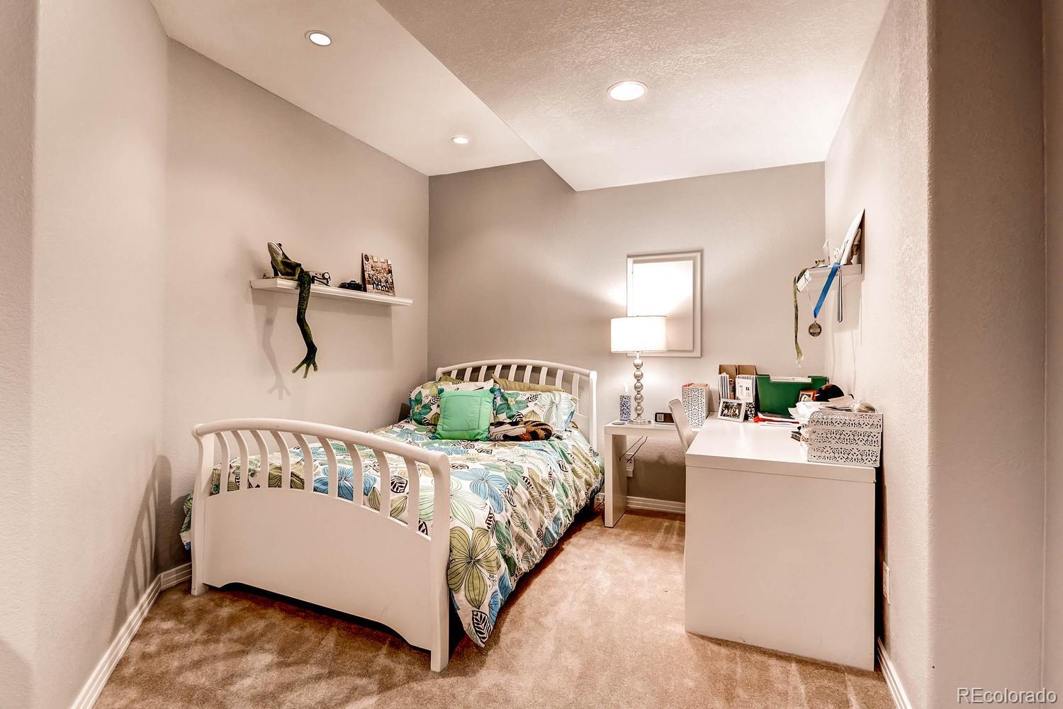 244 South Monroe Street Denver, CO 80209 - Photo 25 of 35 a bedroom with a bed and a window