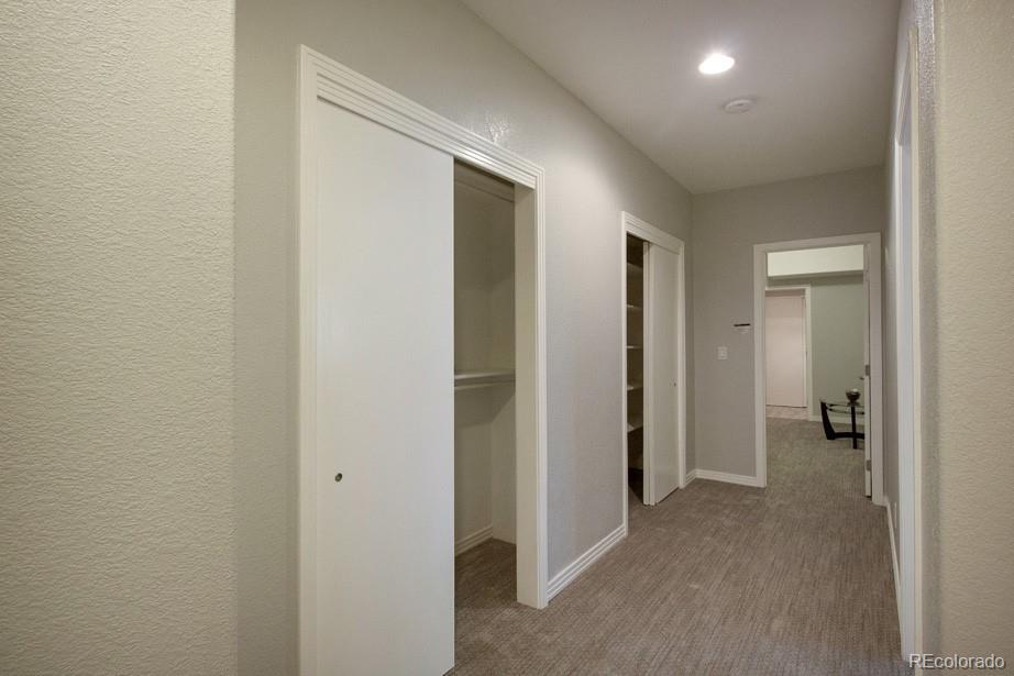 244 South Monroe Street Denver, CO 80209 - Photo 28 of 35 a view of a hallway with a room