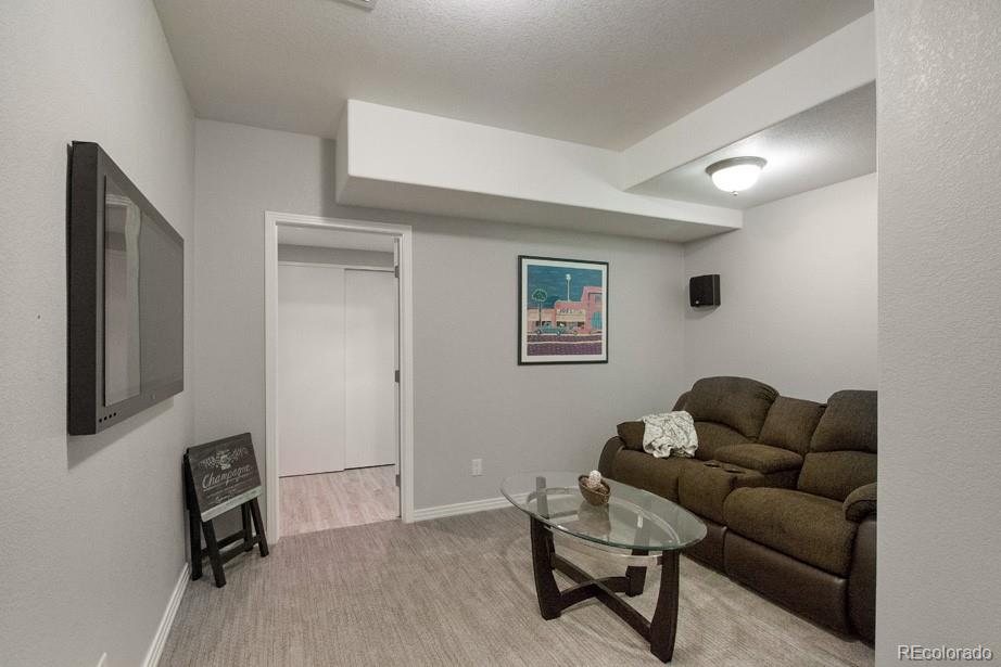 244 South Monroe Street Denver, CO 80209 - Photo 29 of 35 a living room with furniture and a window