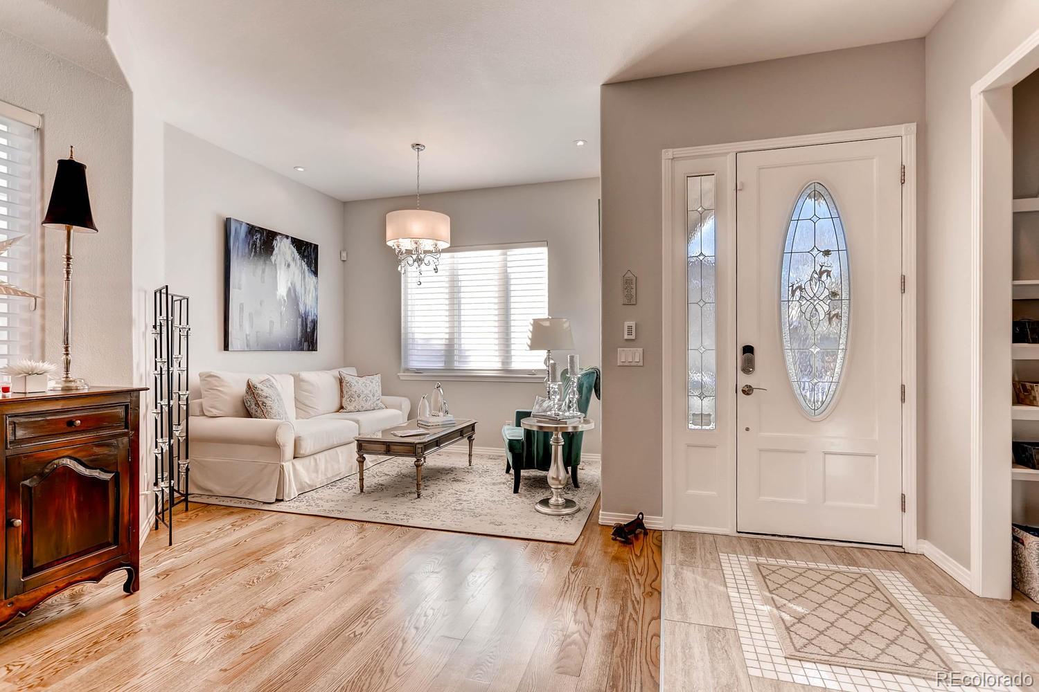 244 South Monroe Street Denver, CO 80209 - Photo 3 of 35 a living room with furniture and a fireplace