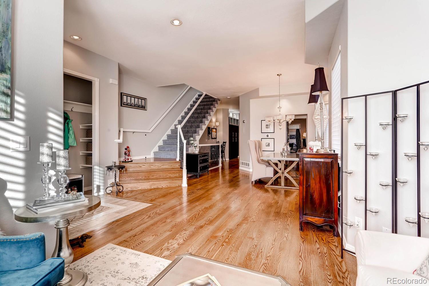 244 South Monroe Street Denver, CO 80209 - Photo 4 of 35 a view of entryway livingroom and hall with wooden floor