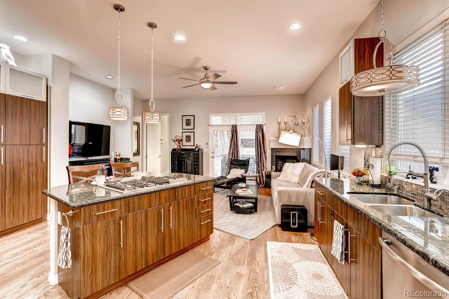 244 South Monroe Street Denver, CO 80209 - Photo 8 of 35 a large kitchen with a counter space a sink appliances and cabinets