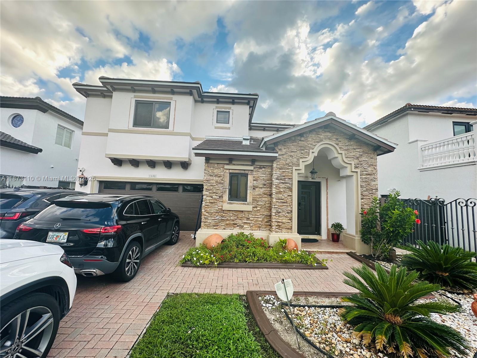 a view of a car parked in front of a house