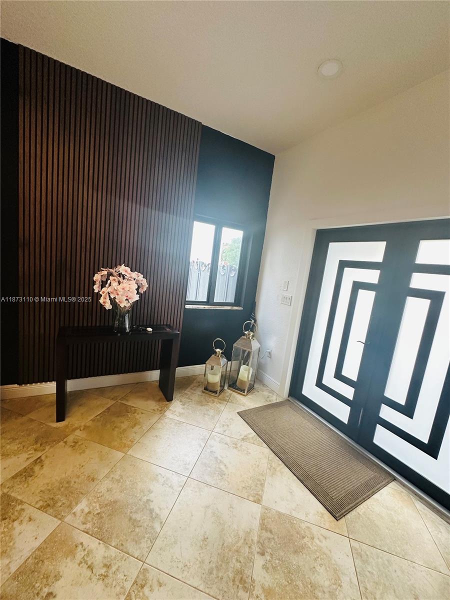 1608 Southwest 154th Court Miami, FL 33185 - Photo 12 of 22 a view of an entryway with wooden floor