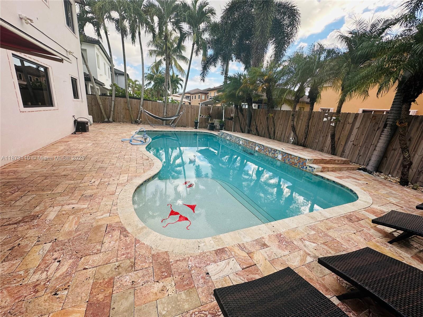 1608 Southwest 154th Court Miami, FL 33185 - Photo 6 of 22 a view of a swimming pool with a patio