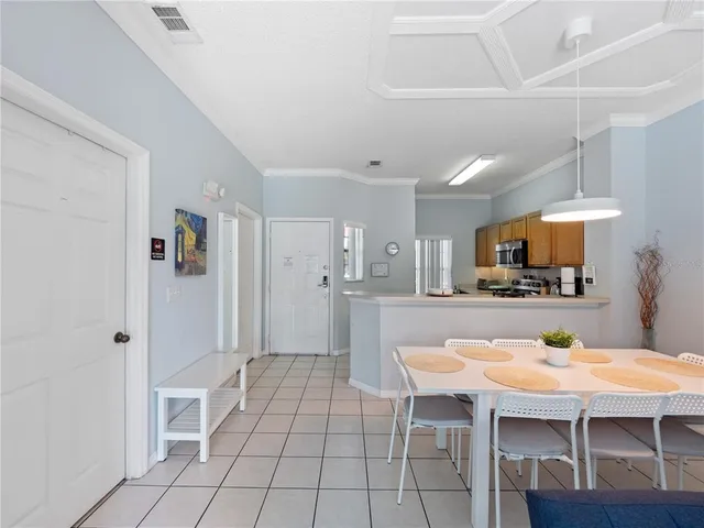 a kitchen with stainless steel appliances kitchen island granite countertop a sink and cabinets